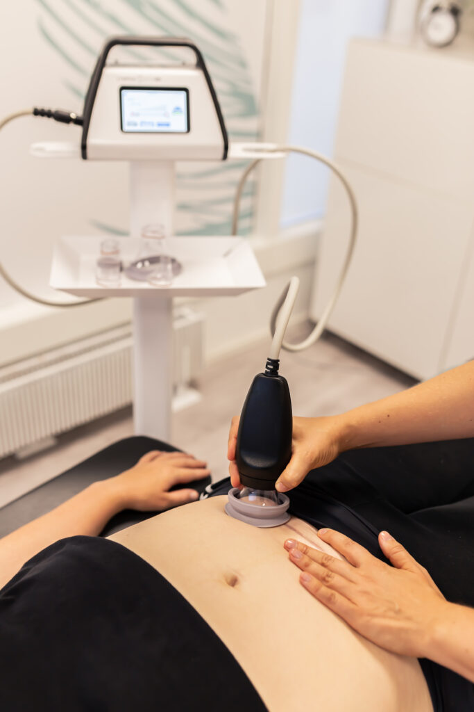Women's health physio is using LymphaTouch device on c-section scar